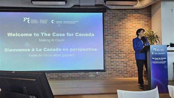 MAP Ai Summit Ottawa 2026 (2) speaker standing by projector screen